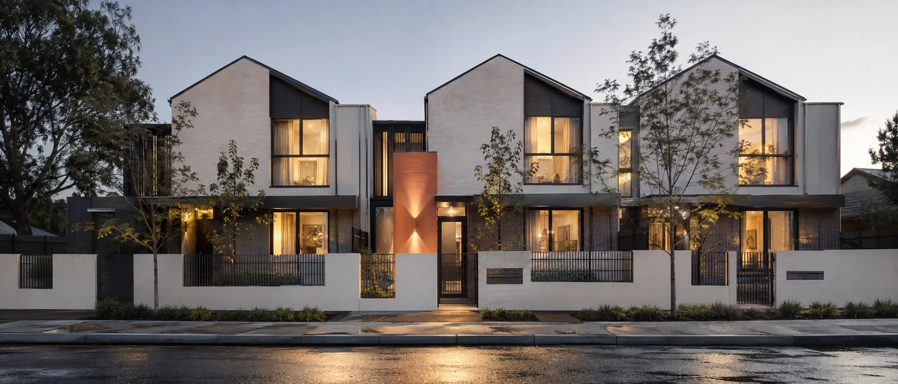 A completed townhouse development at dusk